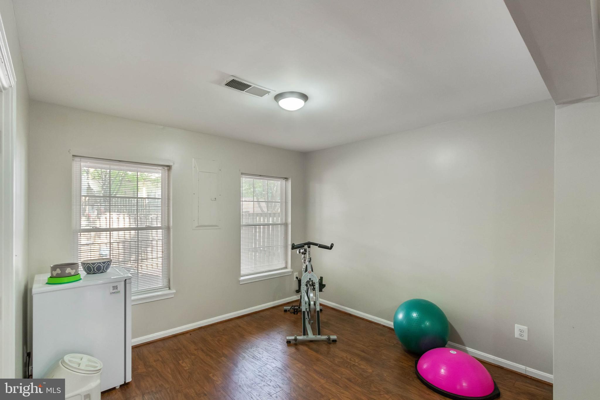 20385 Farmgate Terrace Ashburn, VA 20147 - Photo 22 of 27 a view of a livingroom with wooden floor