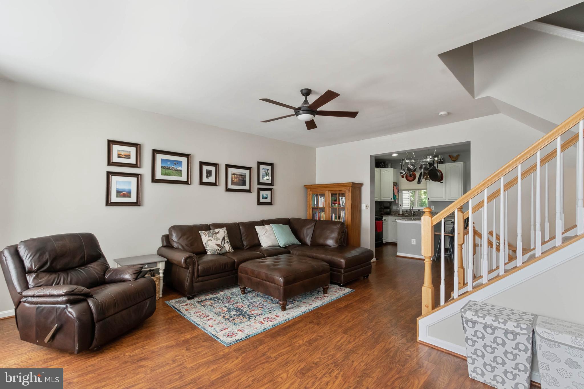20385 Farmgate Terrace Ashburn, VA 20147 - Photo 4 of 27 a living room with furniture and a ceiling fan