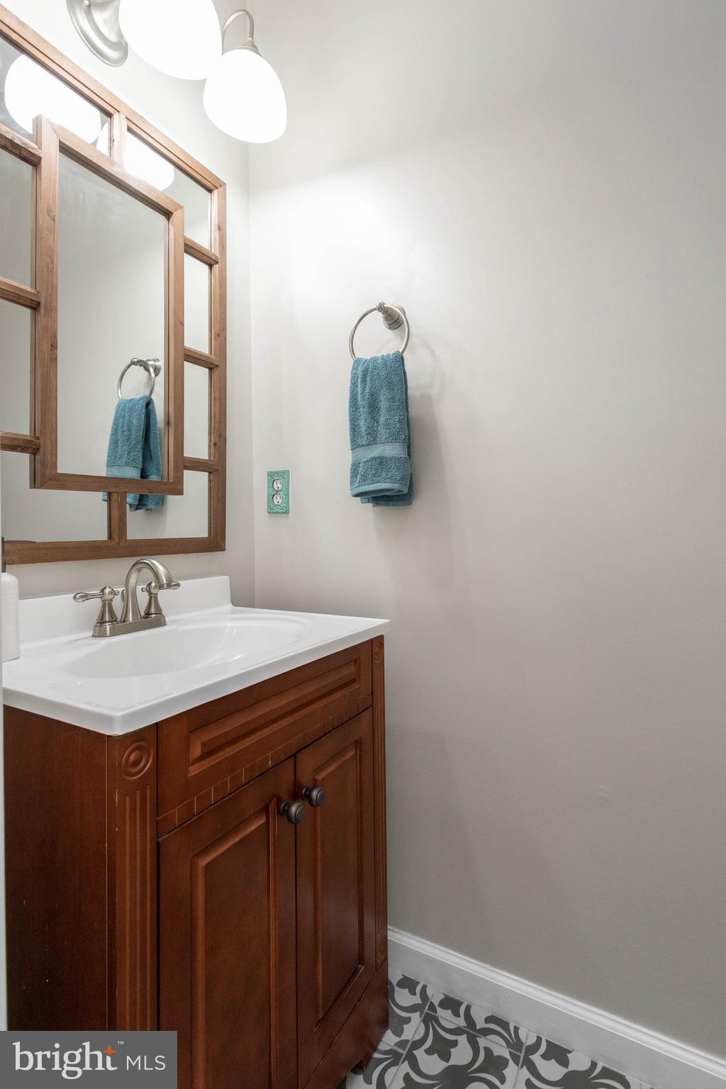 20385 Farmgate Terrace Ashburn, VA 20147 - Photo 10 of 27 a bathroom with a sink and a mirror