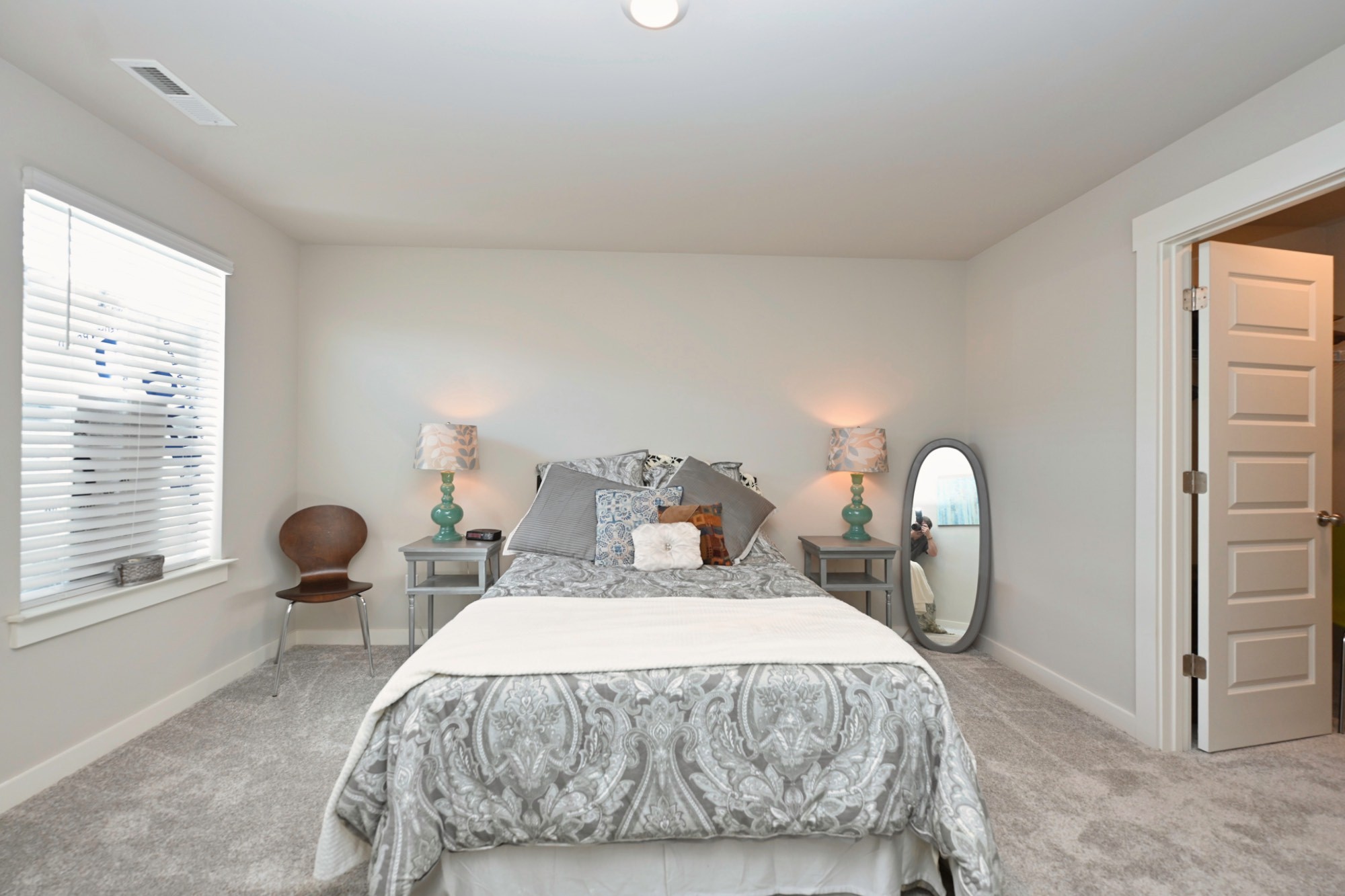 704 Mickelson Way Lebanon, TN 37087 - Photo 25 of 38 a bed sitting in a bedroom next to a window