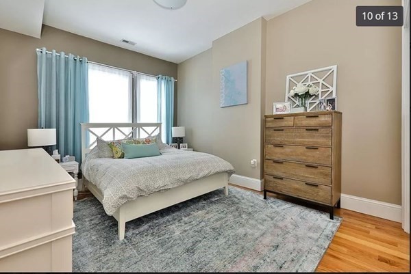 62 H Street, Unit 2 Boston, MA 02127 - Photo 9 of 12 a bedroom with a bed and a window