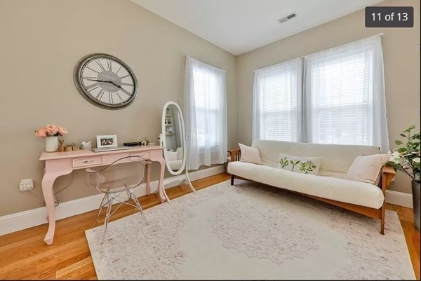 62 H Street, Unit 2 Boston, MA 02127 - Photo 10 of 12 a living room with furniture and a large window