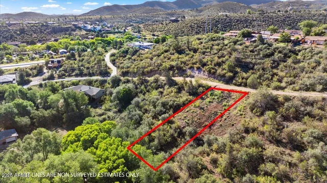 an aerial view of residential houses with outdoor space and pool