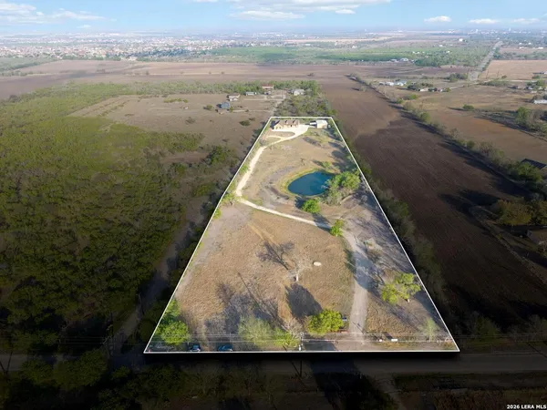 an aerial view of a house with a lake view