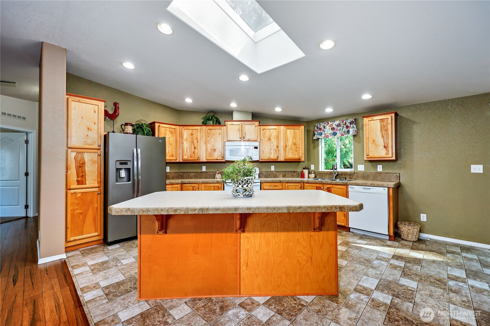 35025 Little Boston Road Northeast Kingston, WA 98346 - Photo 12 of 40 a kitchen with stainless steel appliances granite countertop a refrigerator a oven and a sink