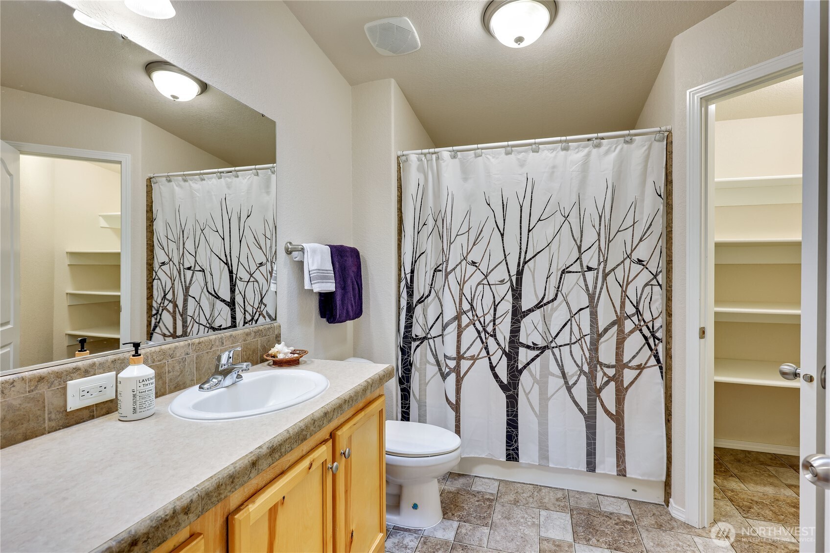 35025 Little Boston Road Northeast Kingston, WA 98346 - Photo 19 of 40 a bathroom with a granite countertop sink toilet and a mirror