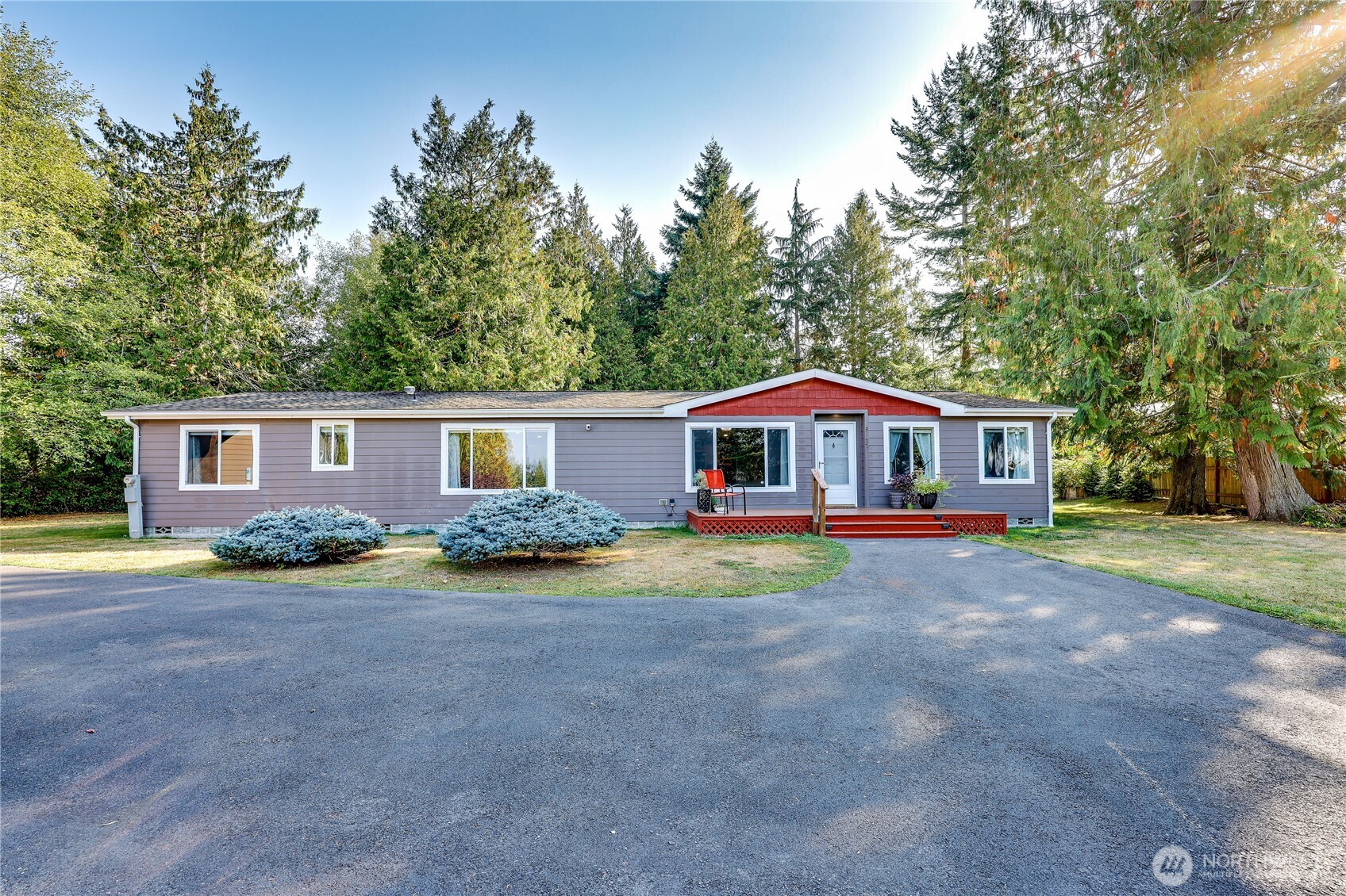 35025 Little Boston Road Northeast Kingston, WA 98346 - Photo 2 of 40 a front view of a house with garden