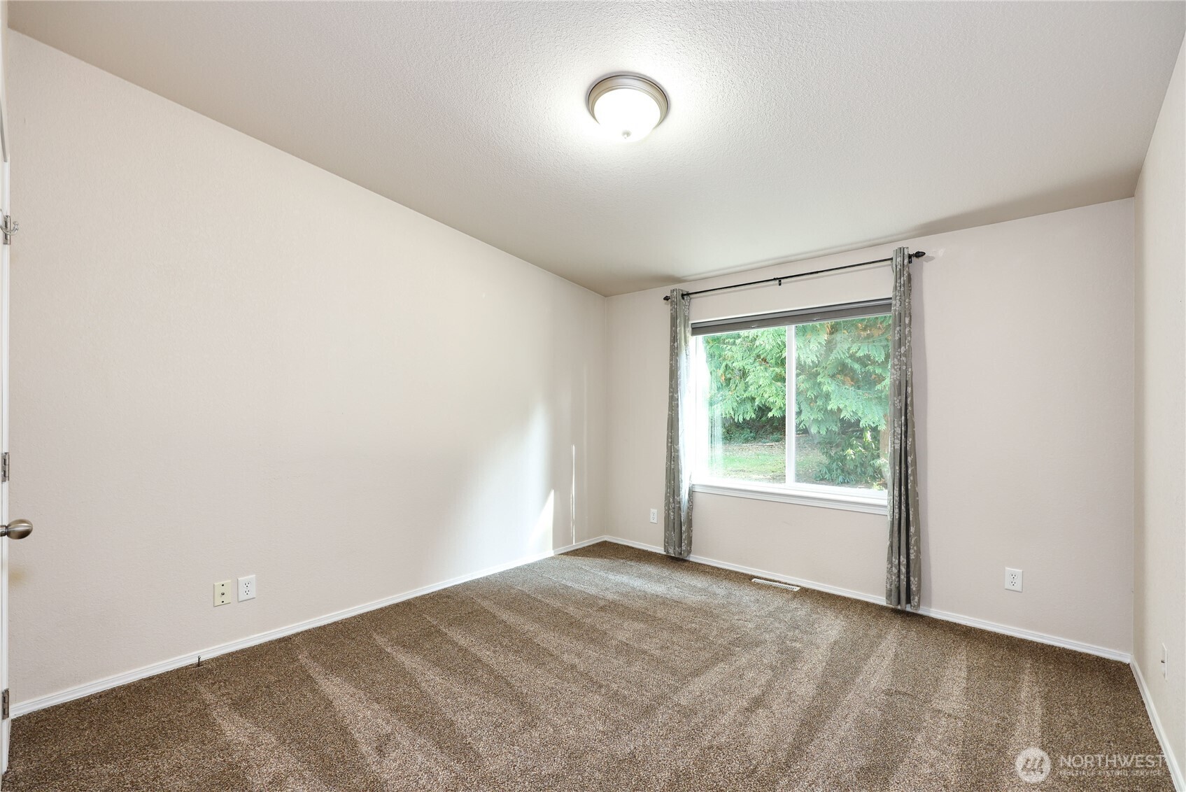 35025 Little Boston Road Northeast Kingston, WA 98346 - Photo 22 of 40 an empty room with a window