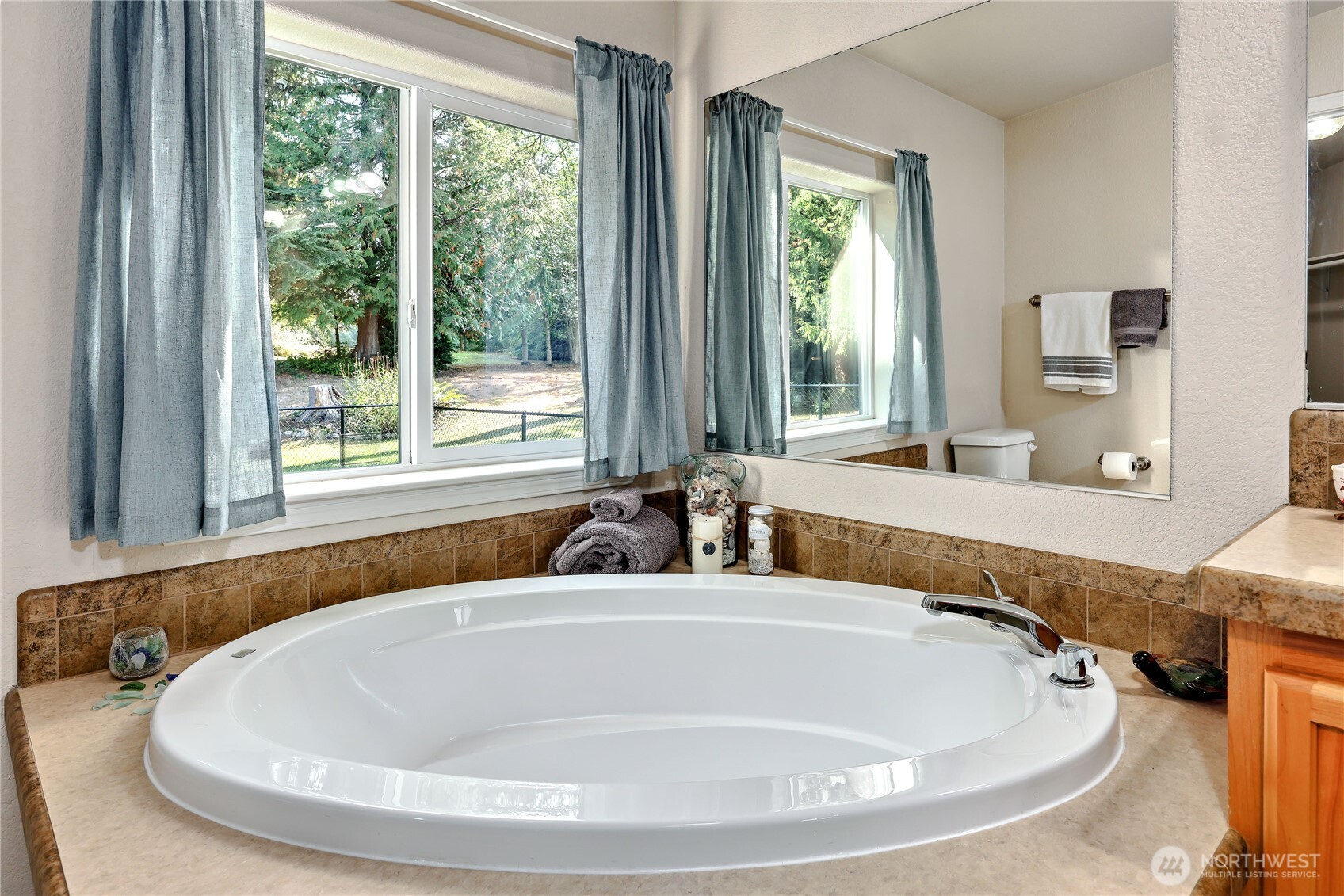 35025 Little Boston Road Northeast Kingston, WA 98346 - Photo 25 of 40 a bathroom with sink and bathtub