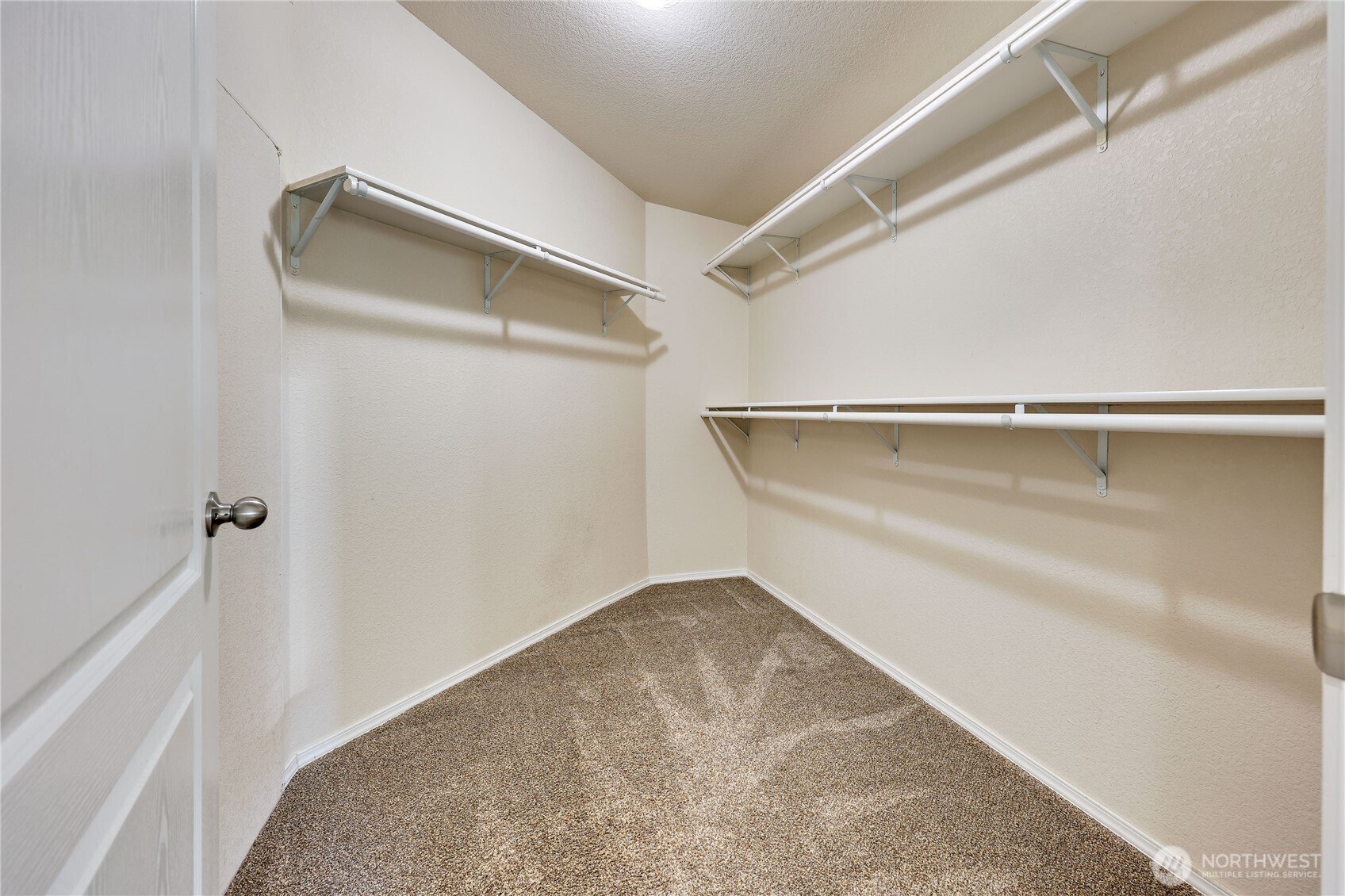 35025 Little Boston Road Northeast Kingston, WA 98346 - Photo 27 of 40 a view of walk in closet with empty racks