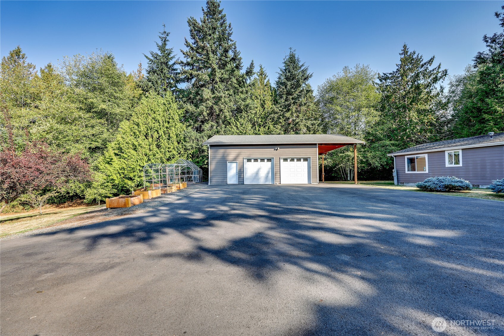 35025 Little Boston Road Northeast Kingston, WA 98346 - Photo 28 of 40 a view of house with outdoor space and tree s