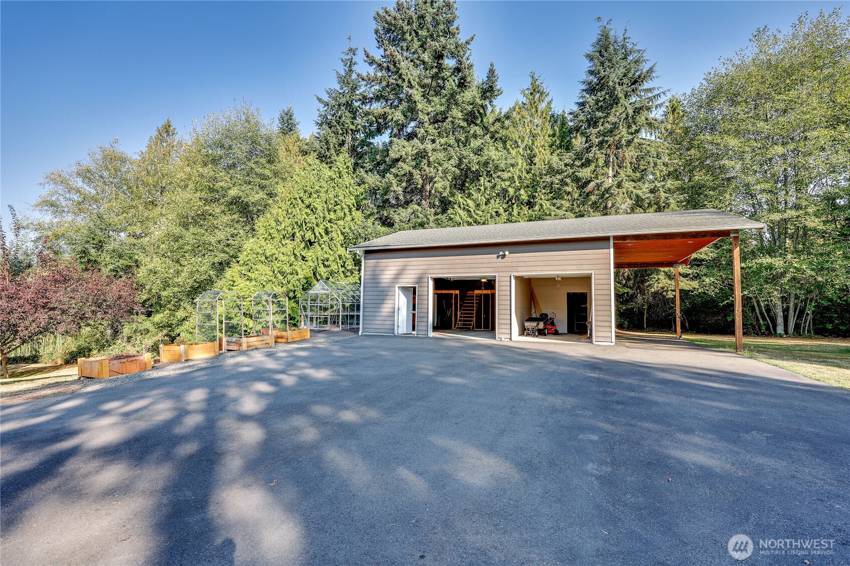 35025 Little Boston Road Northeast Kingston, WA 98346 - Photo 29 of 40 a front view of a house with yard and trees