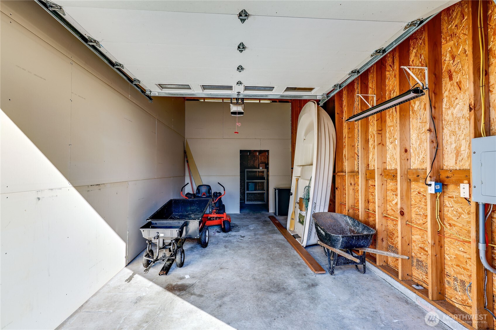 35025 Little Boston Road Northeast Kingston, WA 98346 - Photo 31 of 40 a living room with furniture a window and a ceiling fan