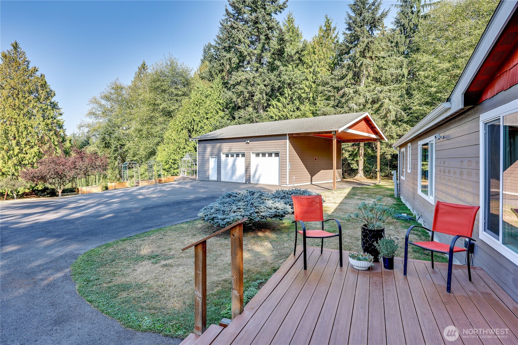 35025 Little Boston Road Northeast Kingston, WA 98346 - Photo 4 of 40 a front view of house with deck and outdoor seating