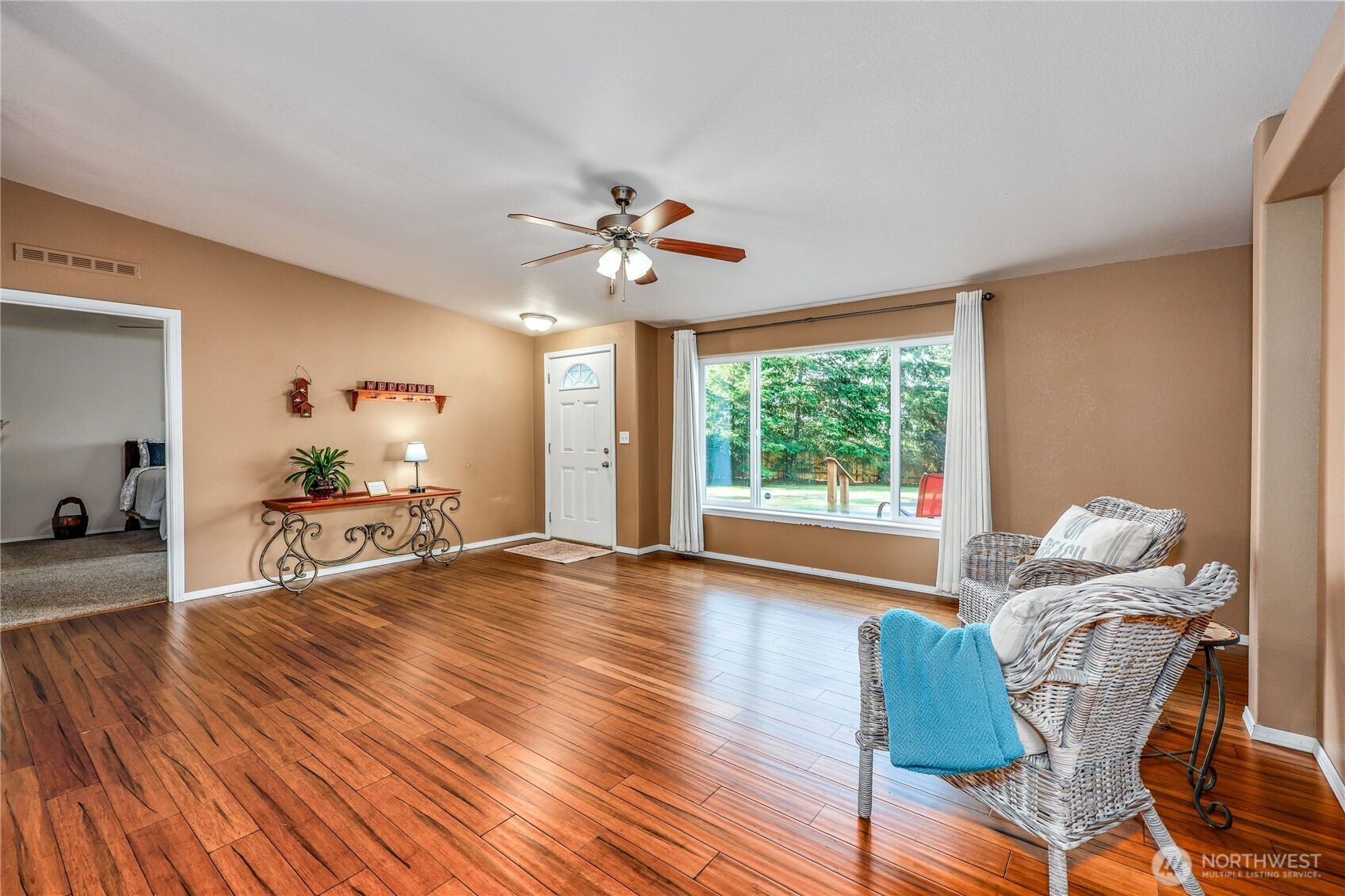 35025 Little Boston Road Northeast Kingston, WA 98346 - Photo 7 of 40 a living room with furniture and a large window