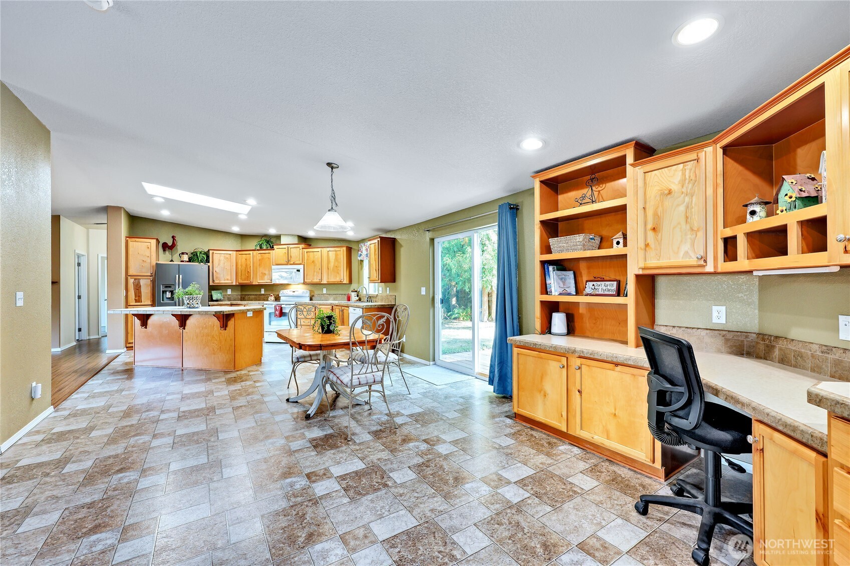 35025 Little Boston Road Northeast Kingston, WA 98346 - Photo 10 of 40 a living room with stainless steel appliances furniture a rug and a kitchen view