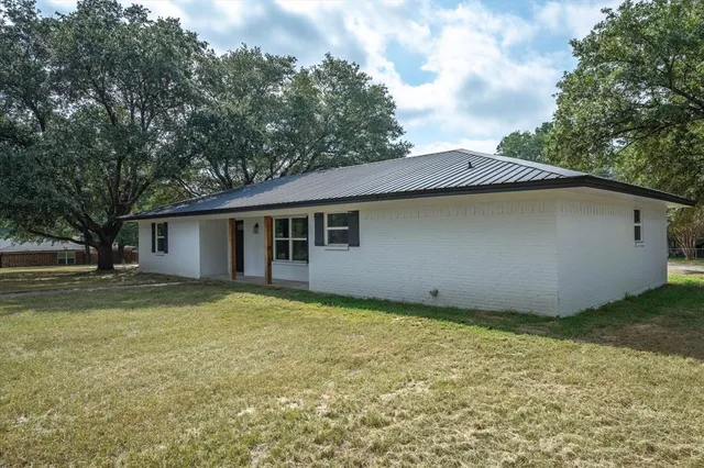 a house that has a big yard in front of it