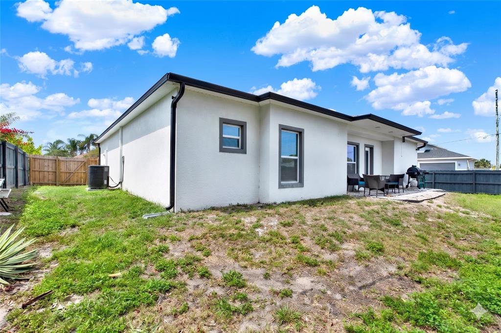 3023 Muir Street Holiday, FL 34691 - Photo 22 of 25 a view of a house with backyard