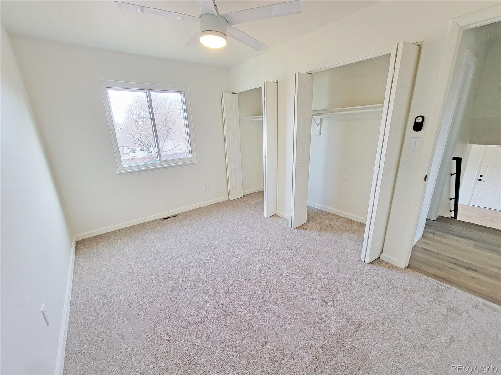 8128 Lafayette Street Denver, CO 80229 - Photo 14 of 19 an empty room with windows and closet