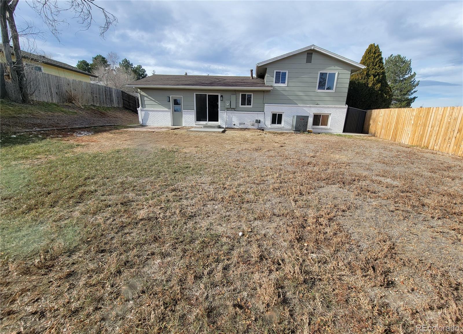 8128 Lafayette Street Denver, CO 80229 - Photo 18 of 19 a house view with a outdoor space