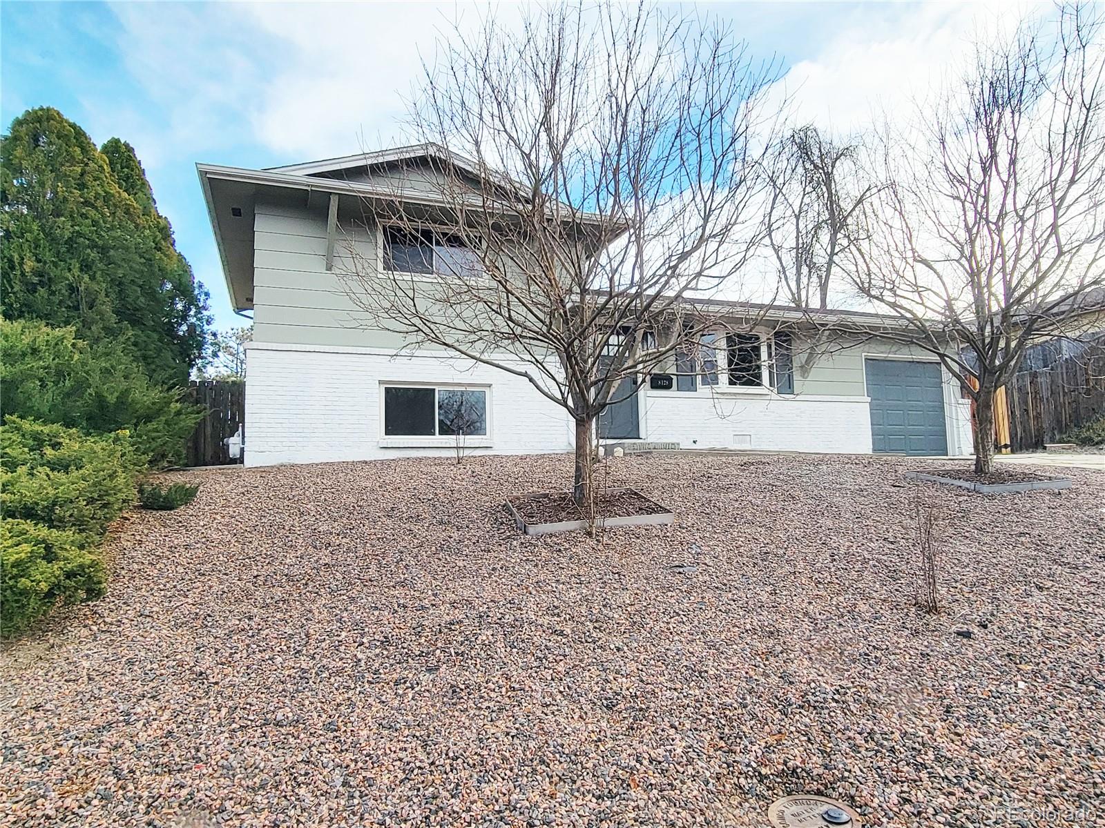 8128 Lafayette Street Denver, CO 80229 - Photo 20 of 20 a front view of a house with a space