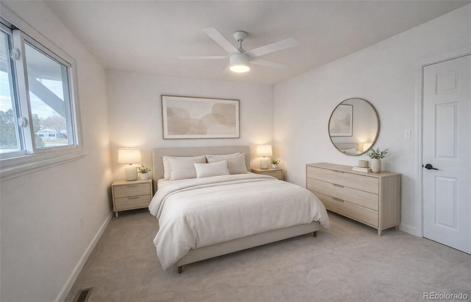 8128 Lafayette Street Denver, CO 80229 - Photo 9 of 19 a bedroom with bed and a chandelier