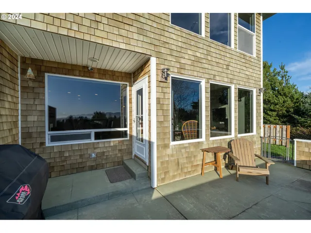 a view of outdoor space and porch with wooden floor
