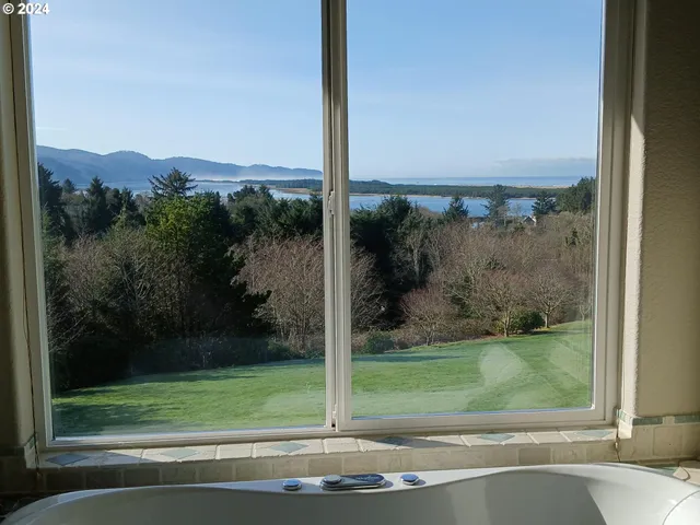 a view of a door and a yard