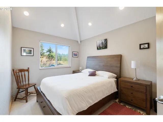a bathroom with a sink vanity mirror and shower