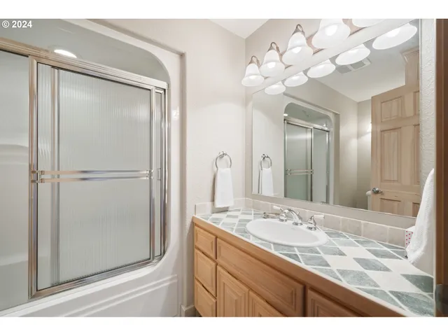 a bed room with a bed window and a chair