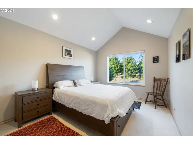 a bedroom with a bed and a night stand