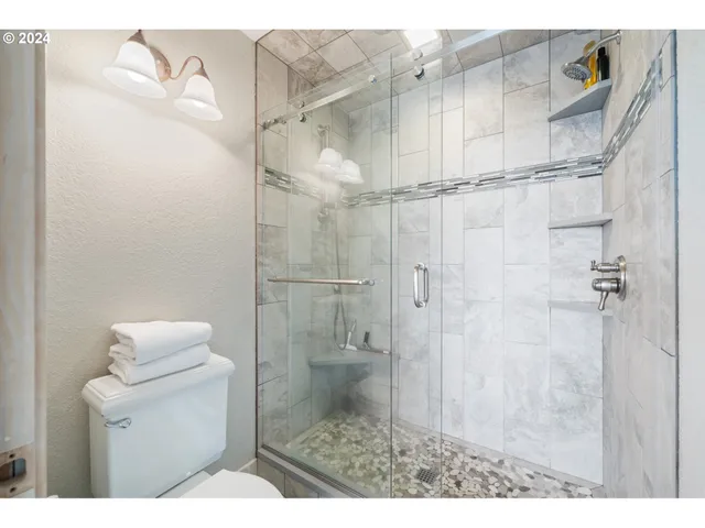 a kitchen with a cabinets and white appliances