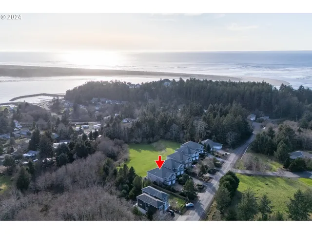 a view of a lush green hillside and houses