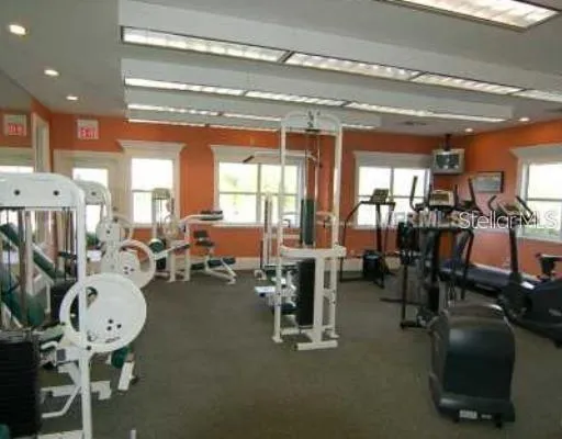 a room with lots of furniture and a chandelier