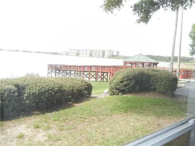 a view of a garden with an ocean view