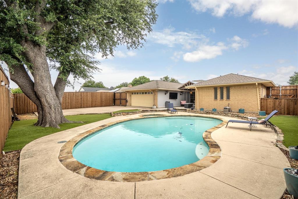 2214 Valley Mill Carrollton, TX 75006 - Photo 32 of 36 a view of a swimming pool with a patio
