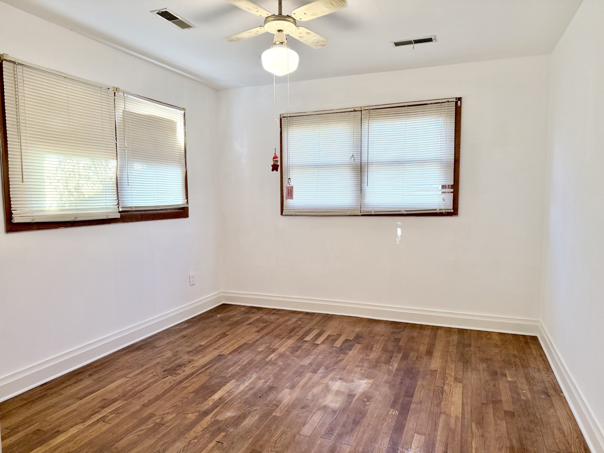 2805 Canton Street Hopkinsville, KY 42240 - Photo 13 of 19 wooden floor in an empty room with a window