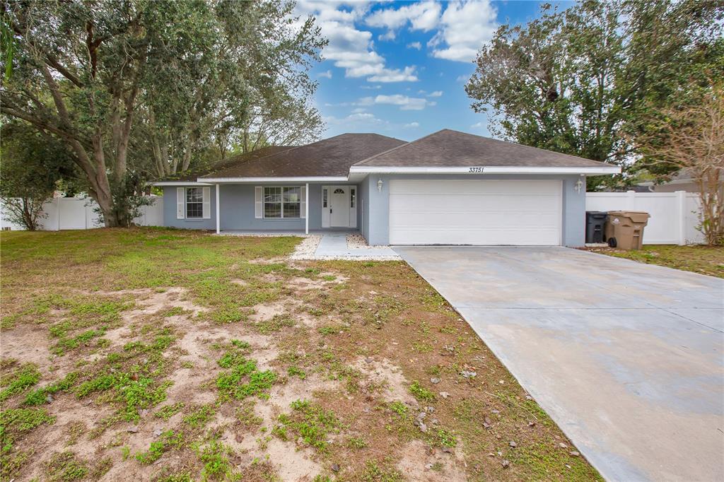 front view of a house with a yard