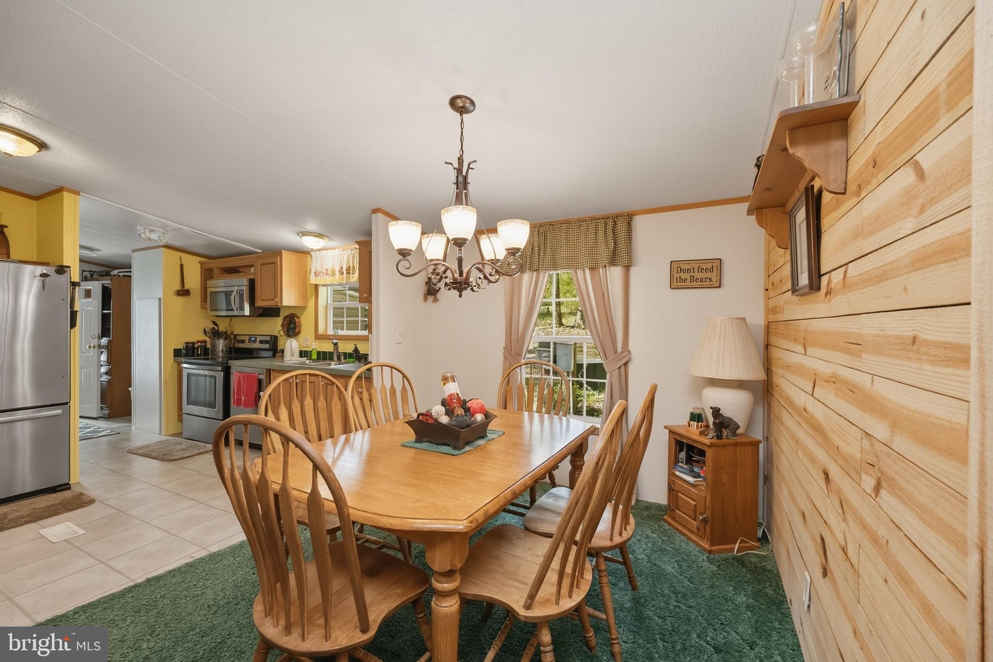 2461 Old Morgantown Road East Accident, MD 21520 - Photo 11 of 50 a view of a dining room with furniture and chandelier