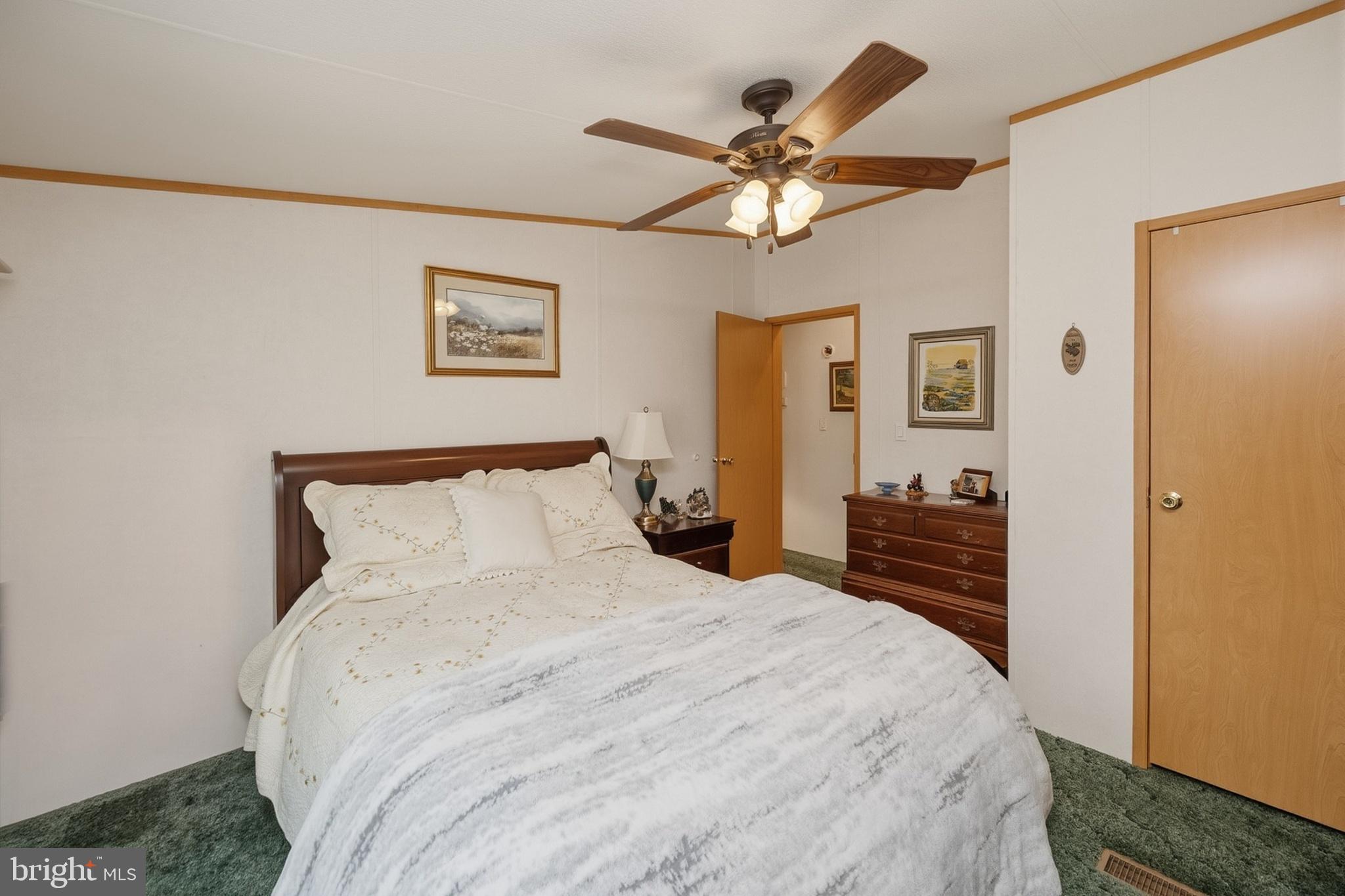 2461 Old Morgantown Road East Accident, MD 21520 - Photo 31 of 50 a bedroom with a large bed and a chandelier
