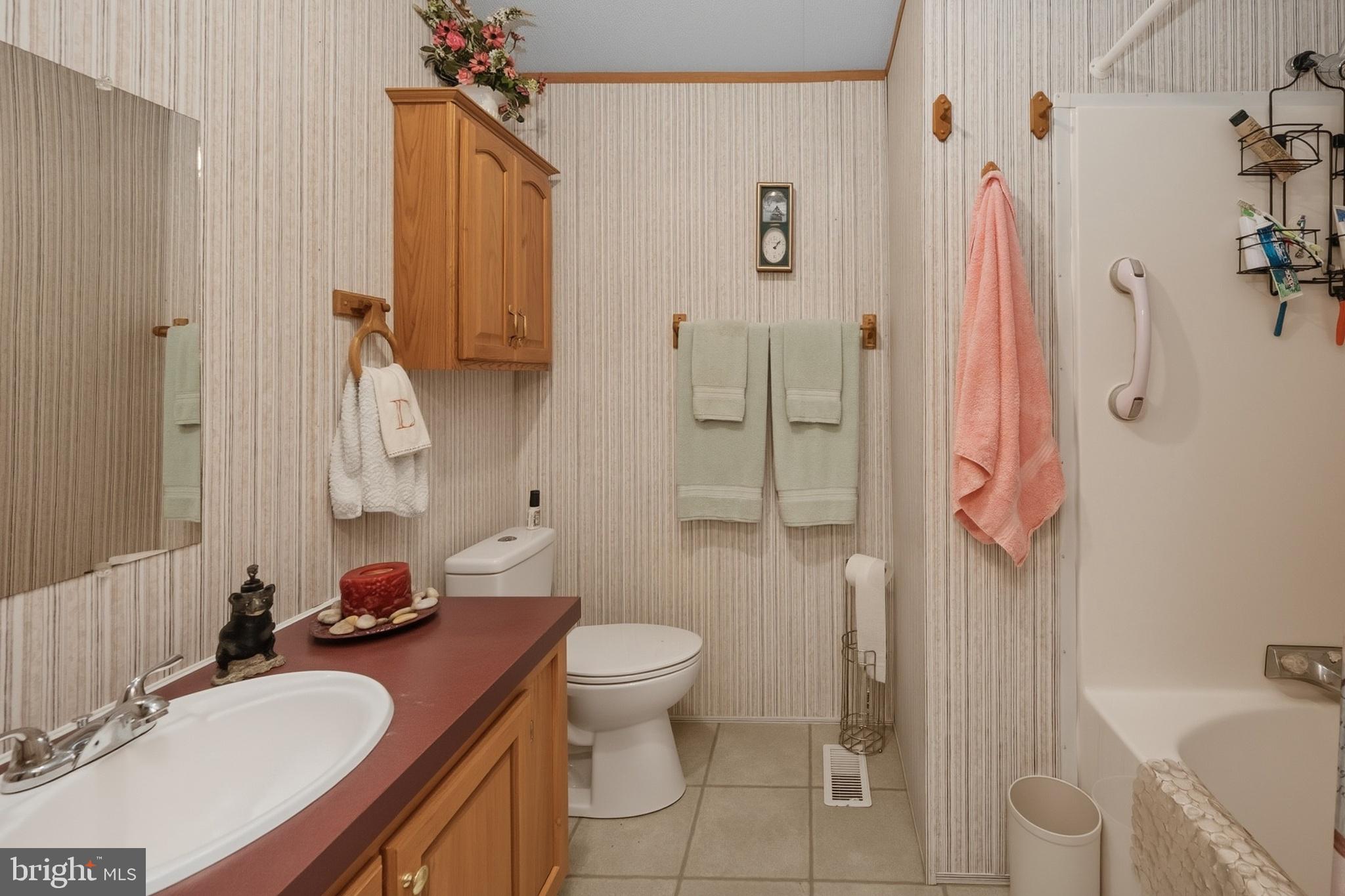 2461 Old Morgantown Road East Accident, MD 21520 - Photo 37 of 50 a bathroom with a granite countertop sink toilet and shower