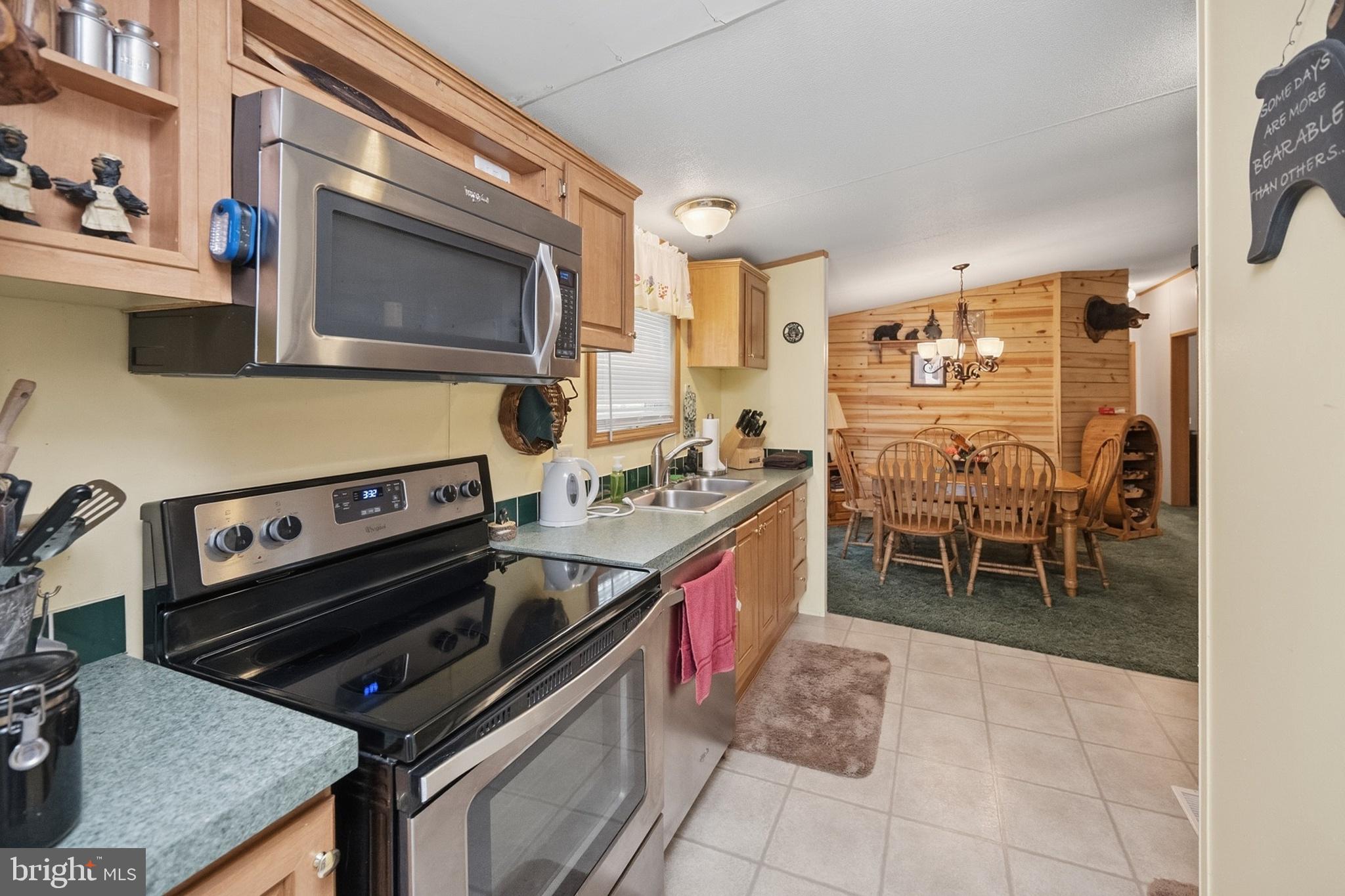 2461 Old Morgantown Road East Accident, MD 21520 - Photo 5 of 50 a kitchen with stainless steel appliances granite countertop a stove and a microwave