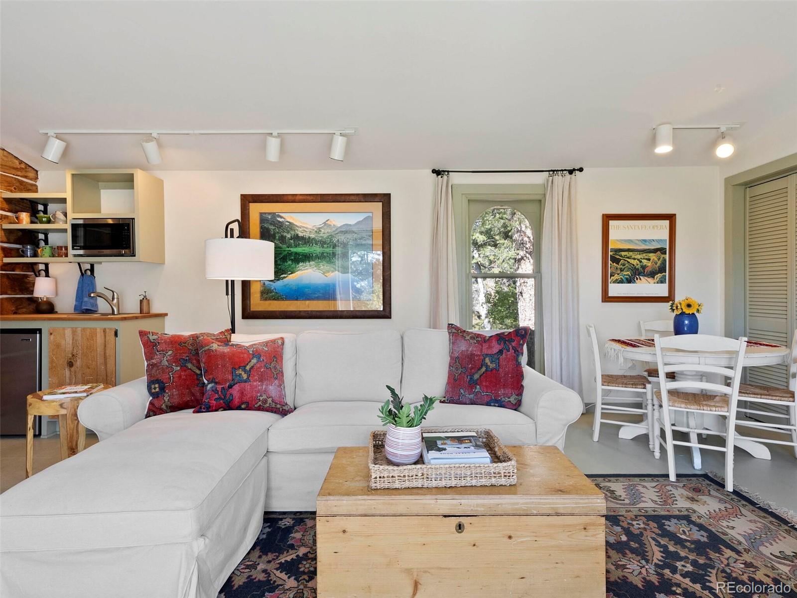 26795 Light Lane Conifer, CO 80433 - Photo 11 of 40 a living room with furniture and wooden floor