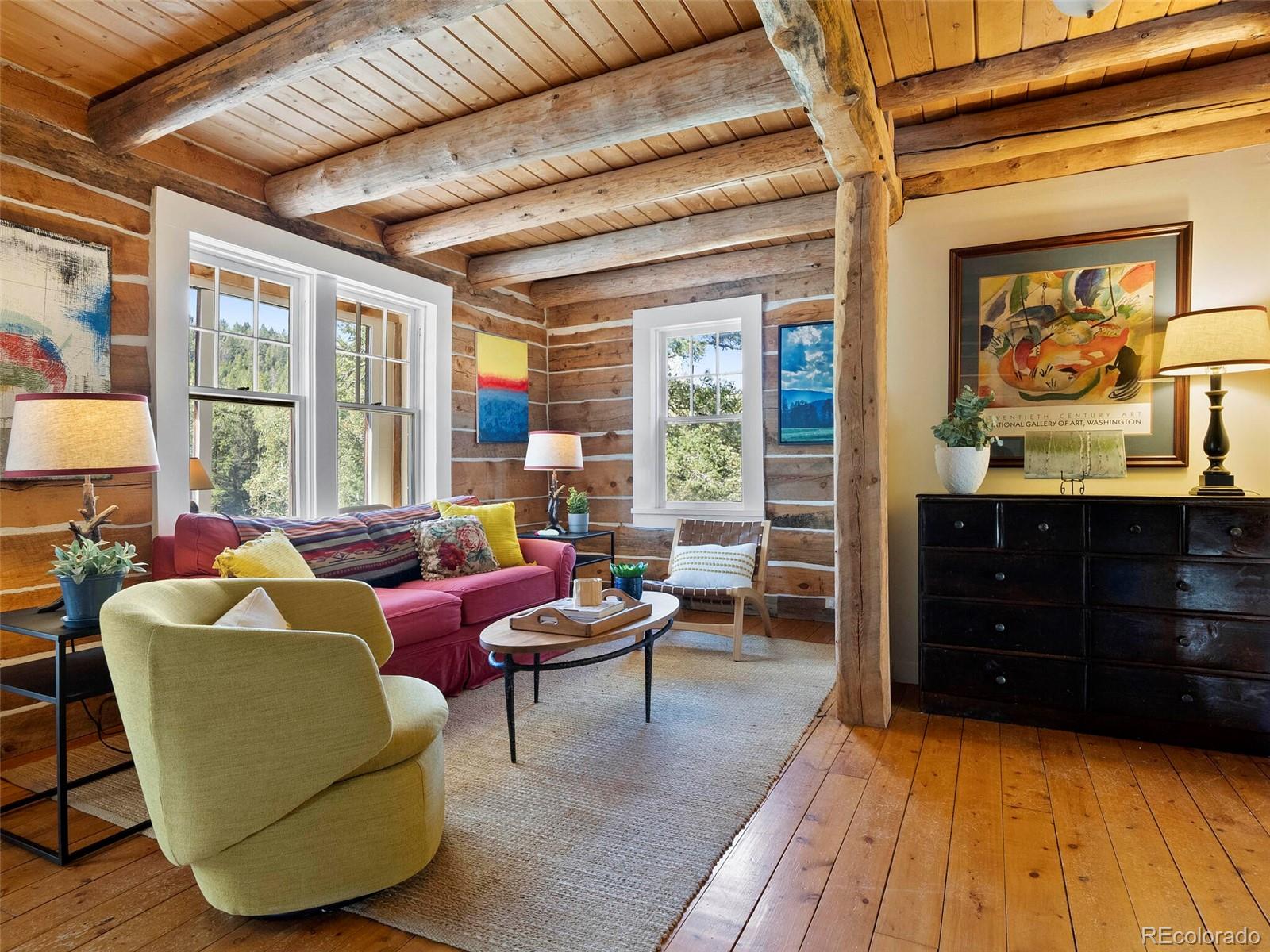 26795 Light Lane Conifer, CO 80433 - Photo 13 of 40 a living room with furniture and a window