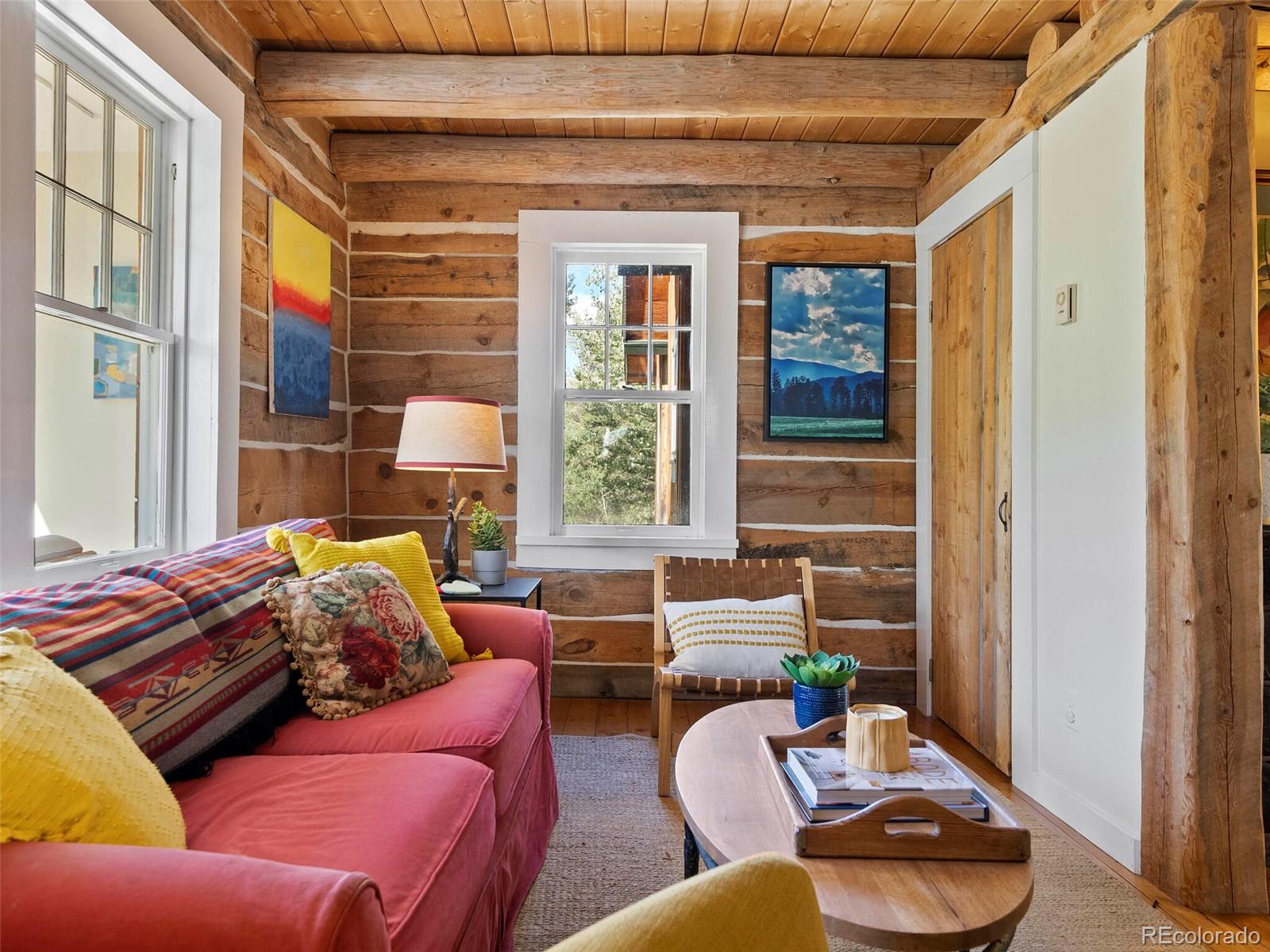 26795 Light Lane Conifer, CO 80433 - Photo 14 of 40 a living room with furniture and a window