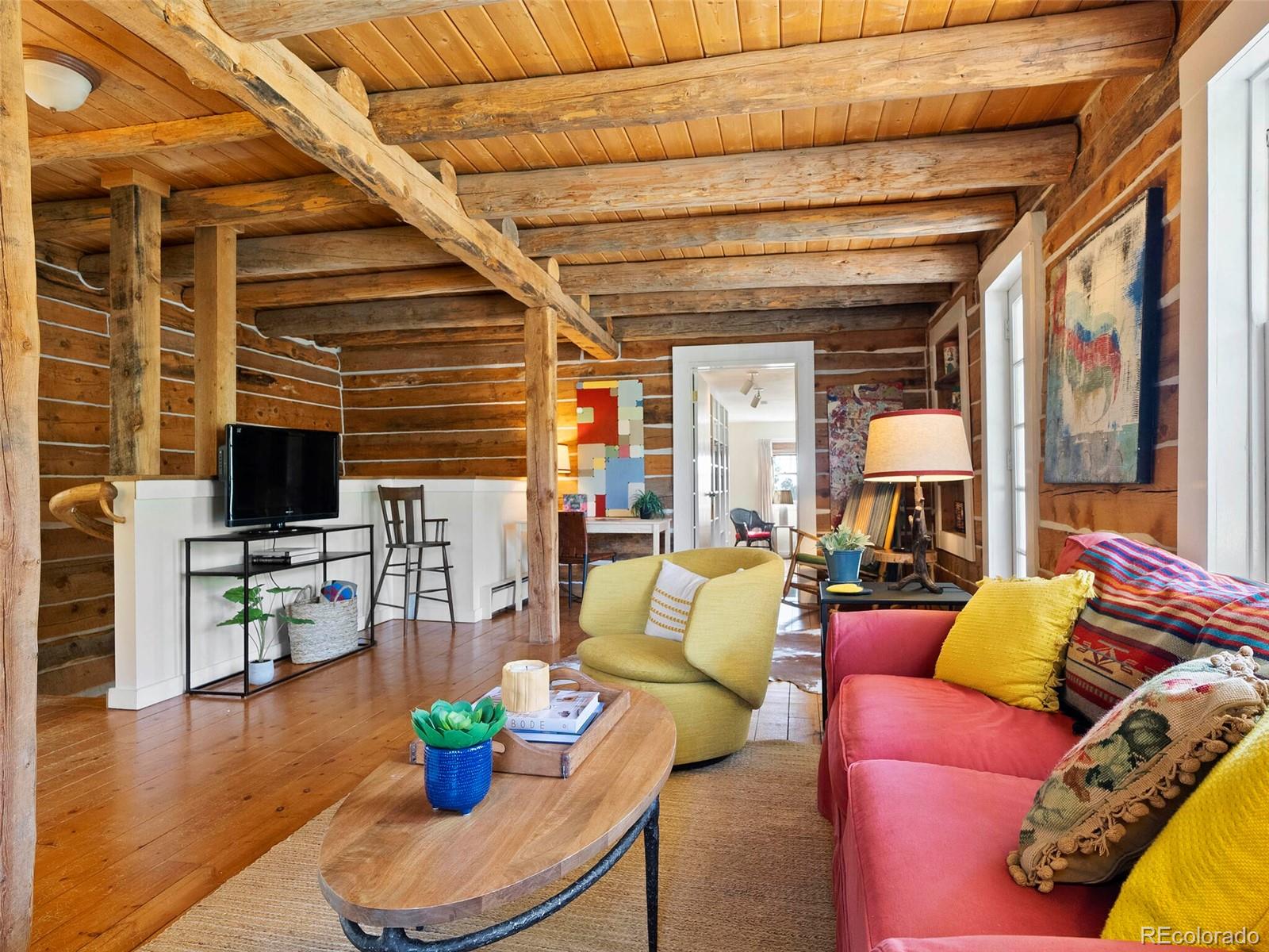 26795 Light Lane Conifer, CO 80433 - Photo 15 of 40 a living room with furniture and a wooden floor