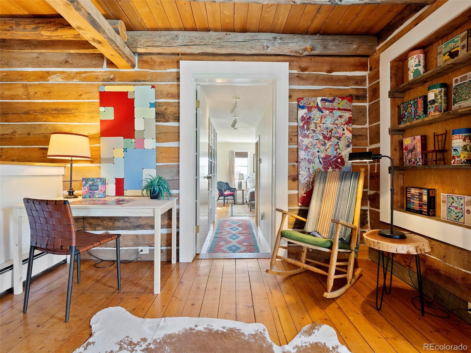 26795 Light Lane Conifer, CO 80433 - Photo 16 of 40 a living room with furniture and a wooden floor