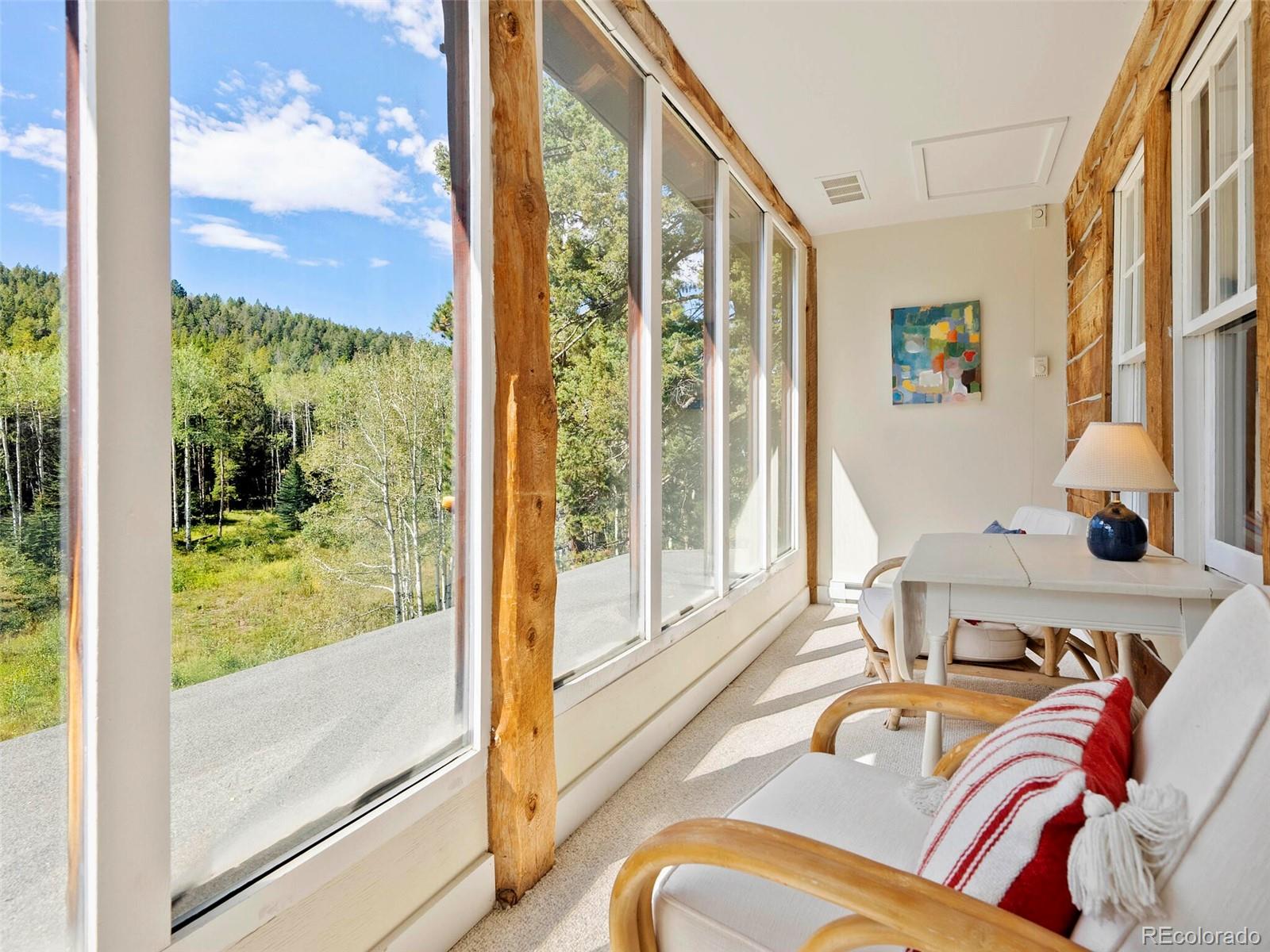 26795 Light Lane Conifer, CO 80433 - Photo 17 of 40 a living room with a large window