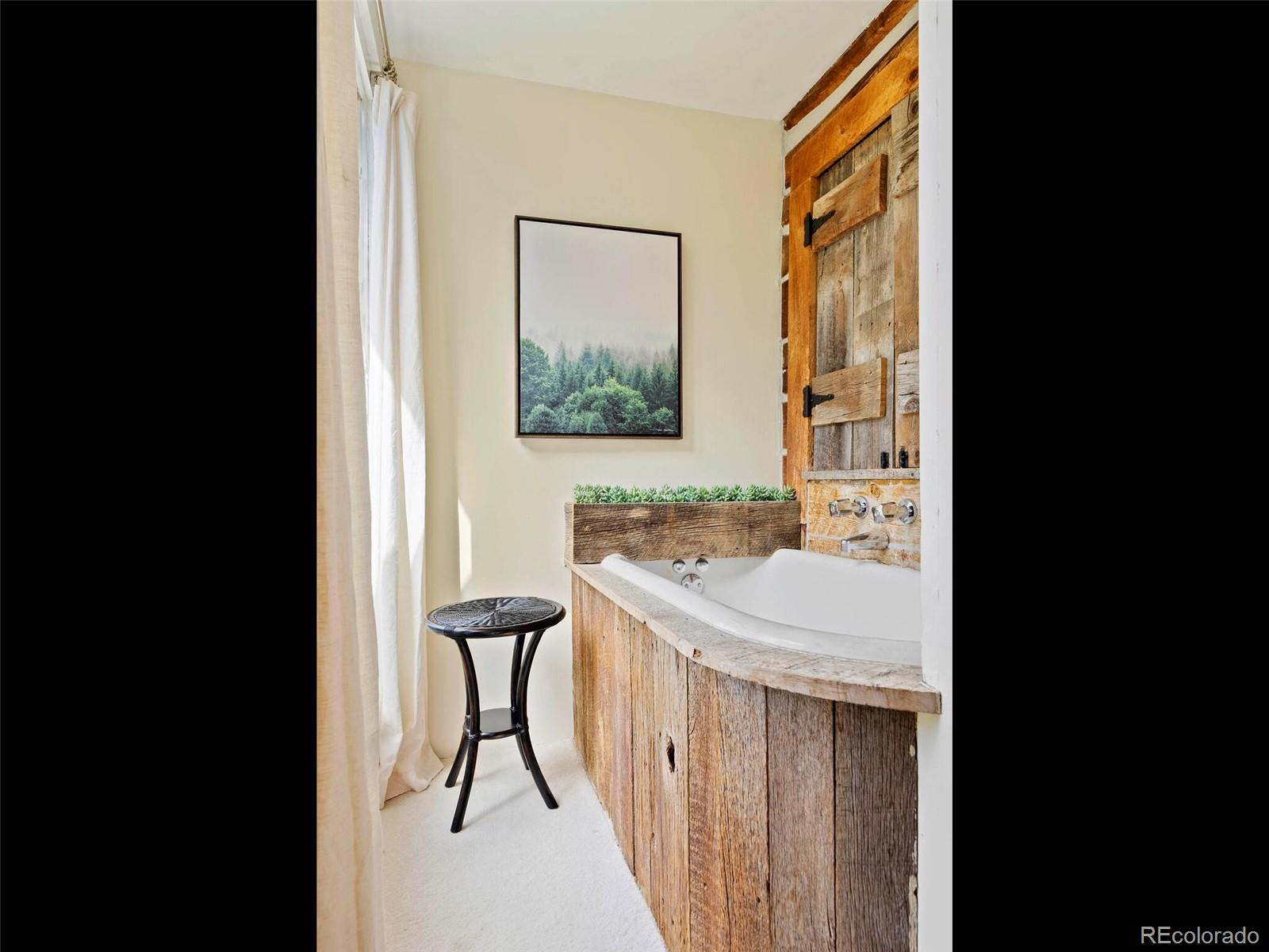 26795 Light Lane Conifer, CO 80433 - Photo 21 of 40 a bathroom with a sink and a mirror