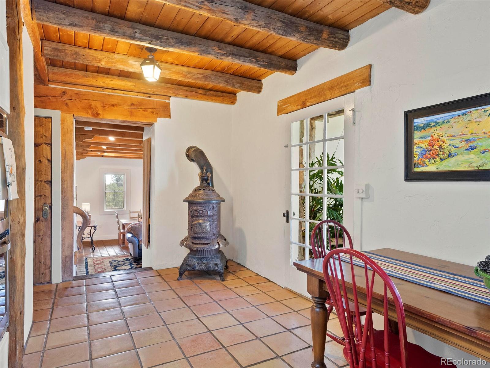 26795 Light Lane Conifer, CO 80433 - Photo 29 of 40 a view of an entryway with wooden floor